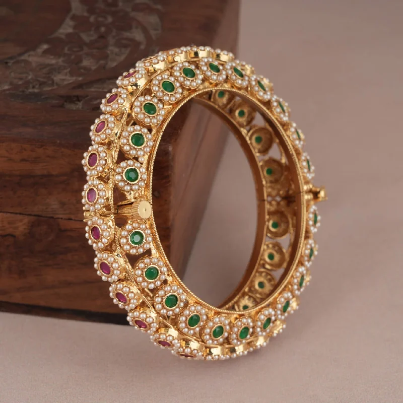 Beautiful gold finish pearl studded stone kada